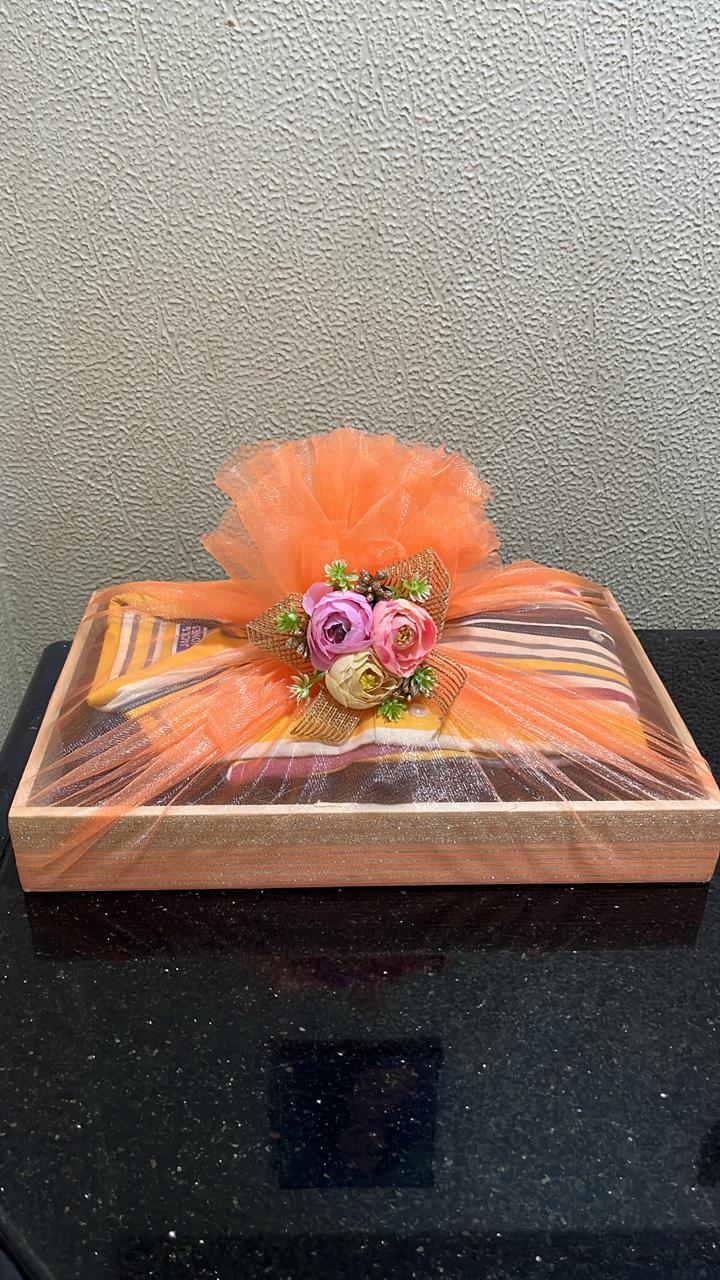 Luxury gift tray with orange tulle and roses